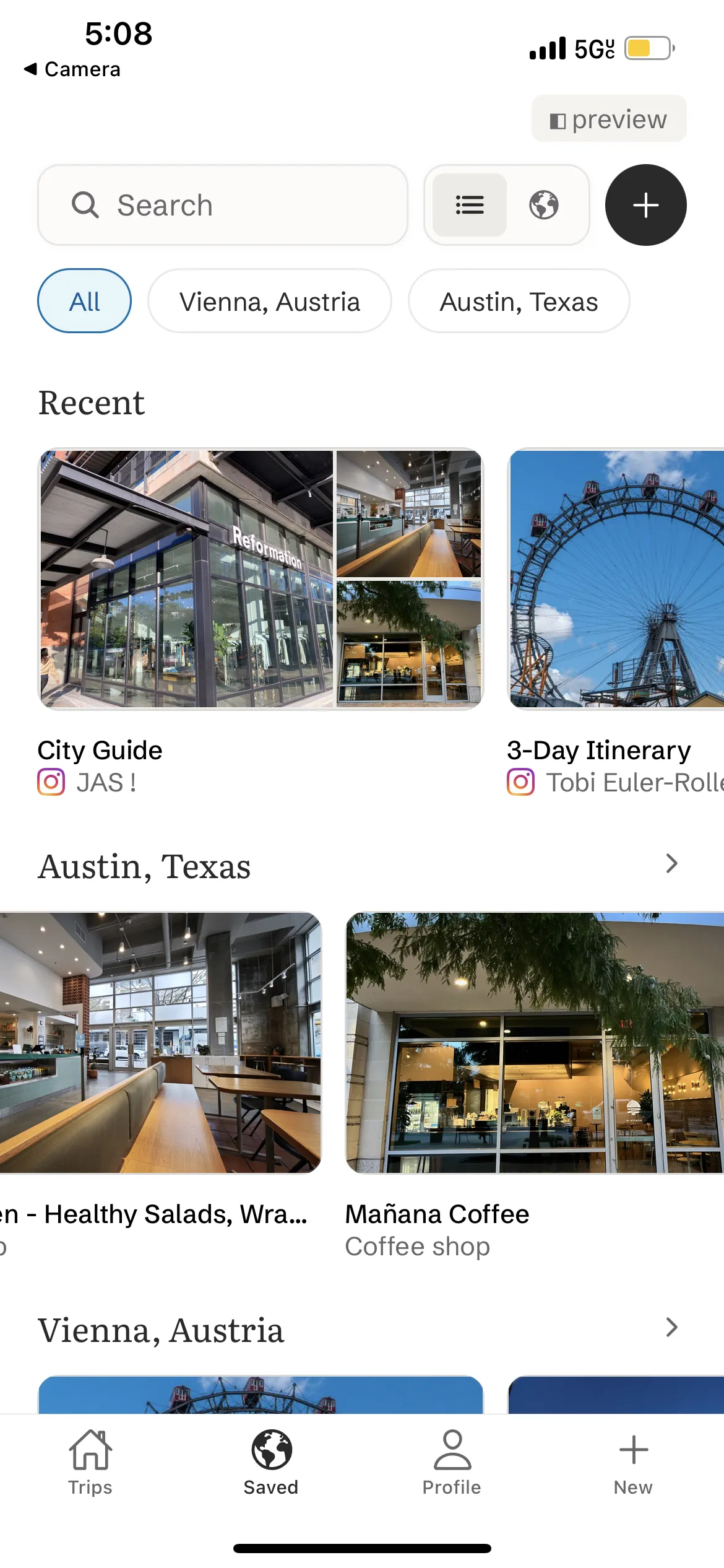 The Saved tab with recent imports and places grouped by city